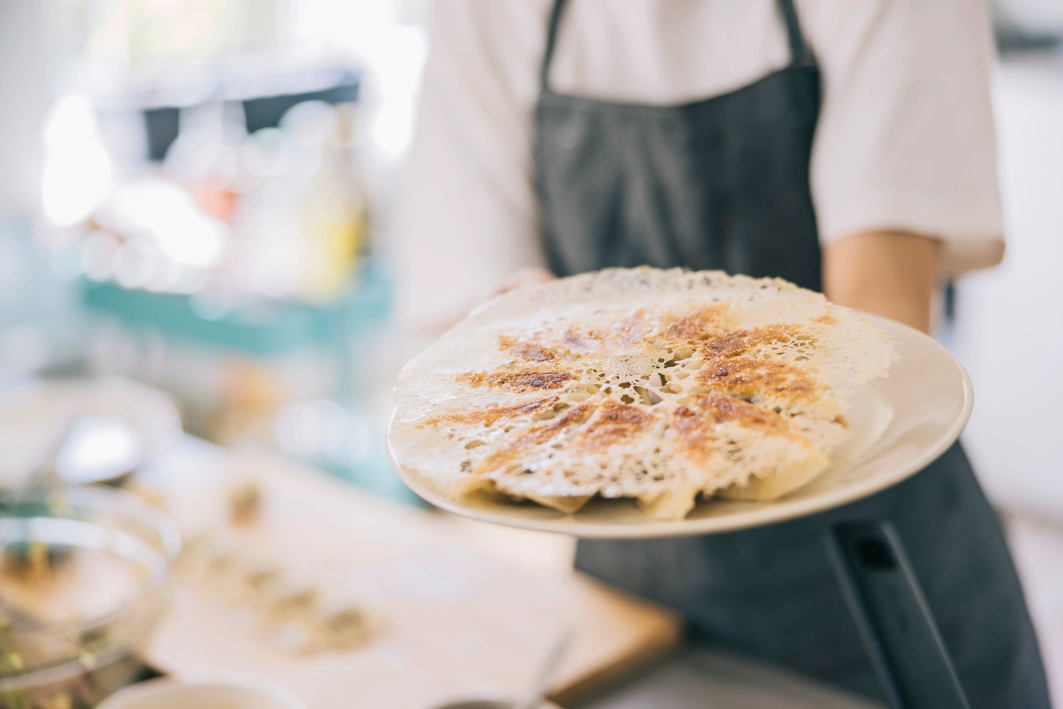 Chef presenting freshly made food during an online cooking class