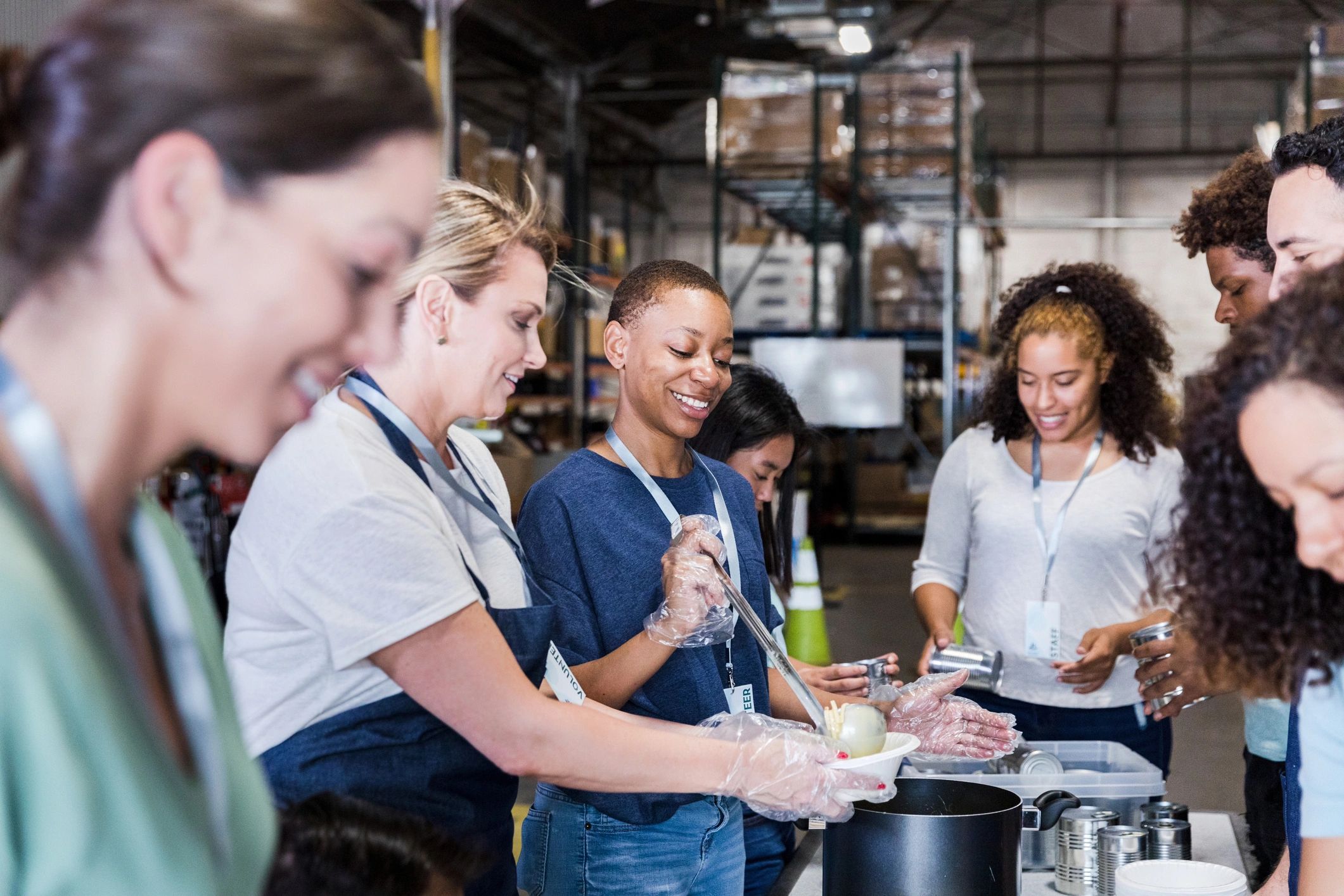 Diverse group of volunteers working at the warehouse