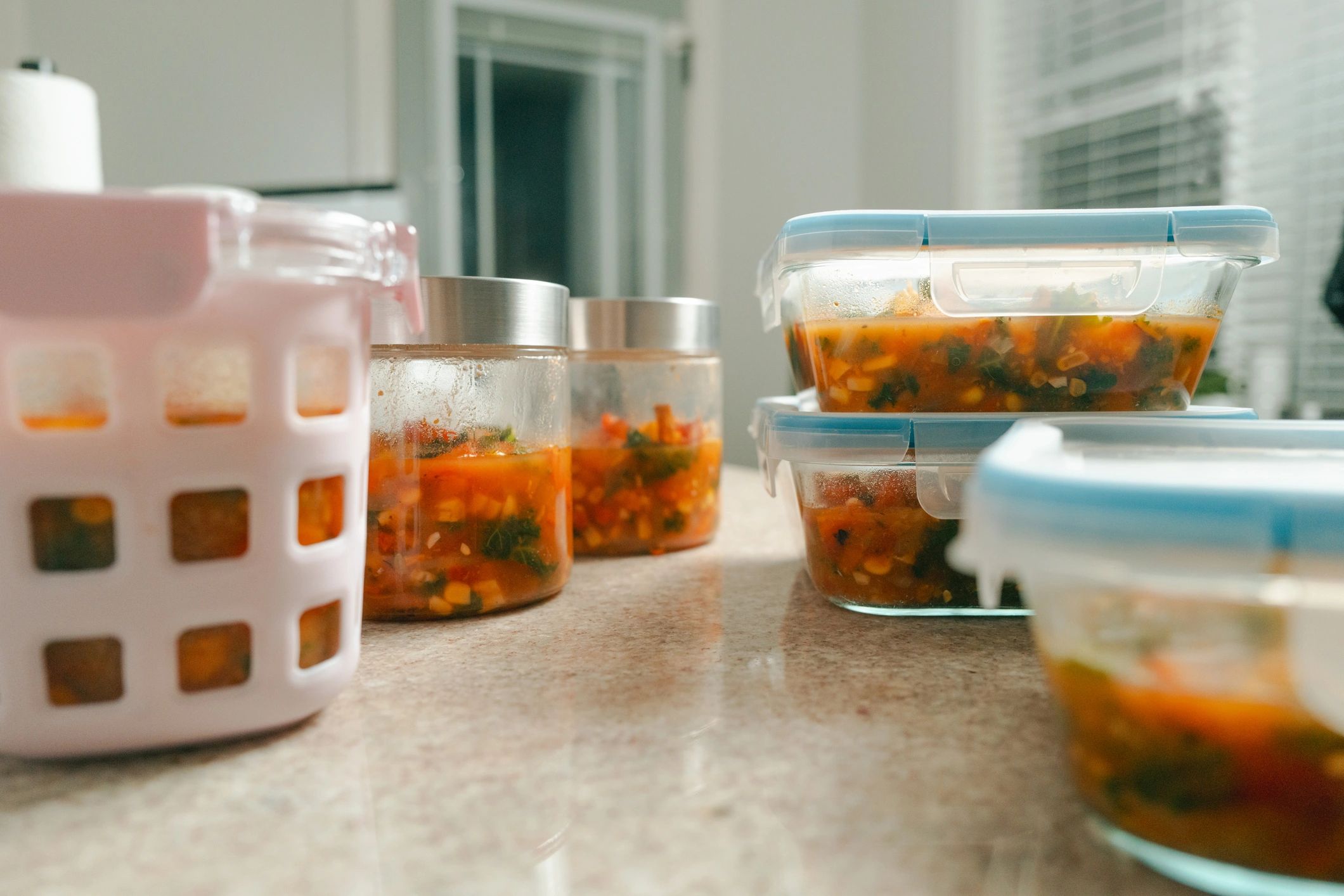 Food Storage Containers Filled with Soup - Meal Prep - Low Wide Shot