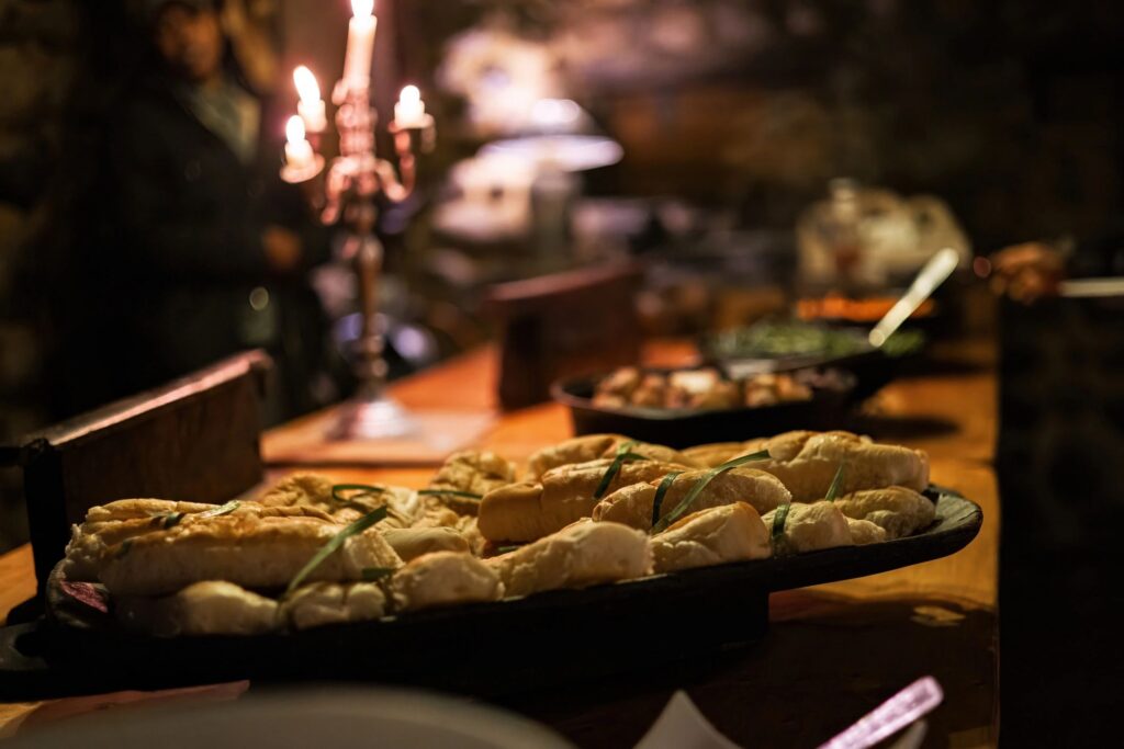 Buffet Table with Bread Display in Candlelight