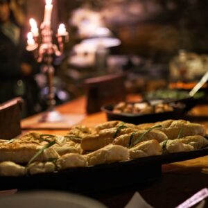 Buffet Table with Bread Display in Candlelight