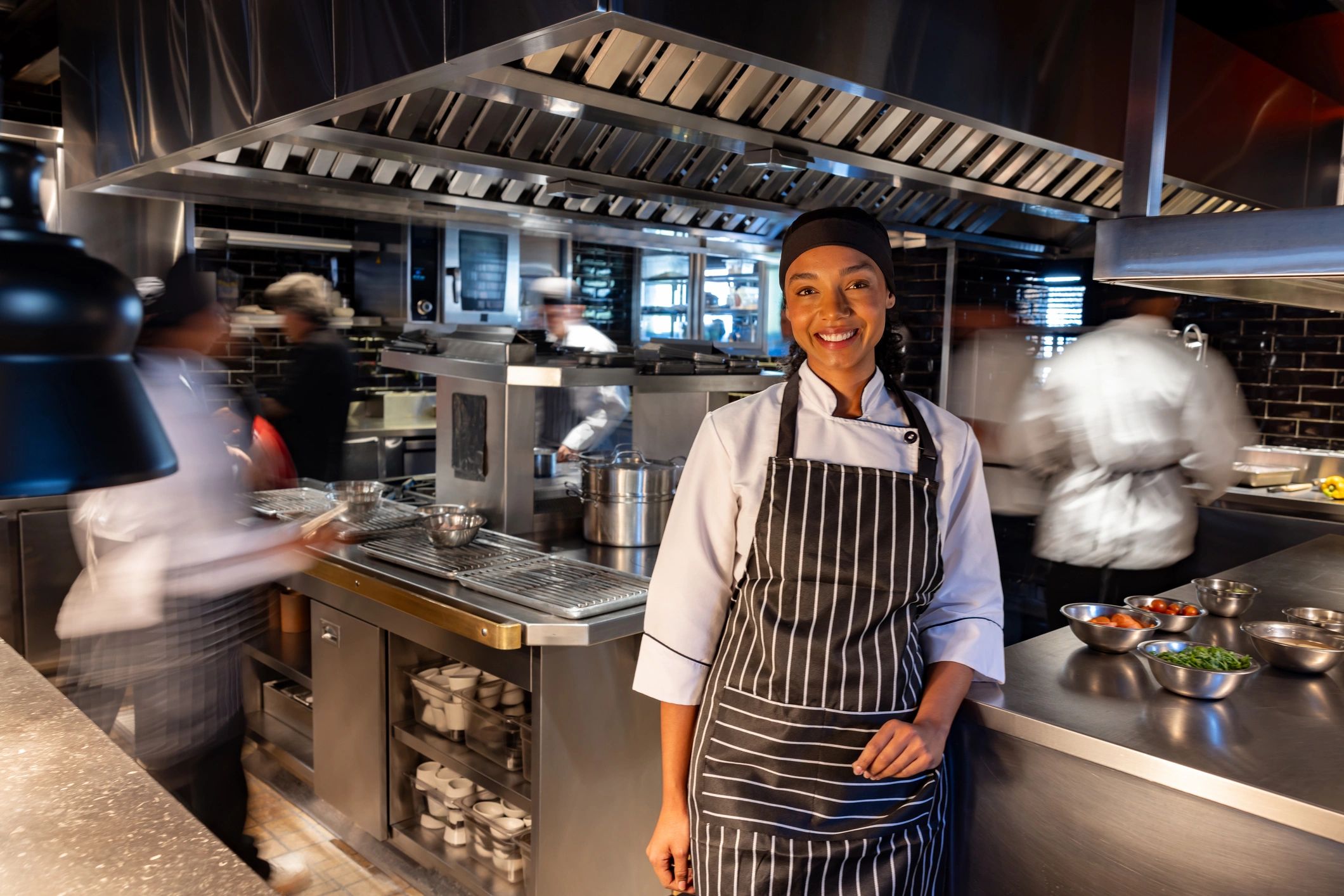 Chef smiling while working in a kitchen