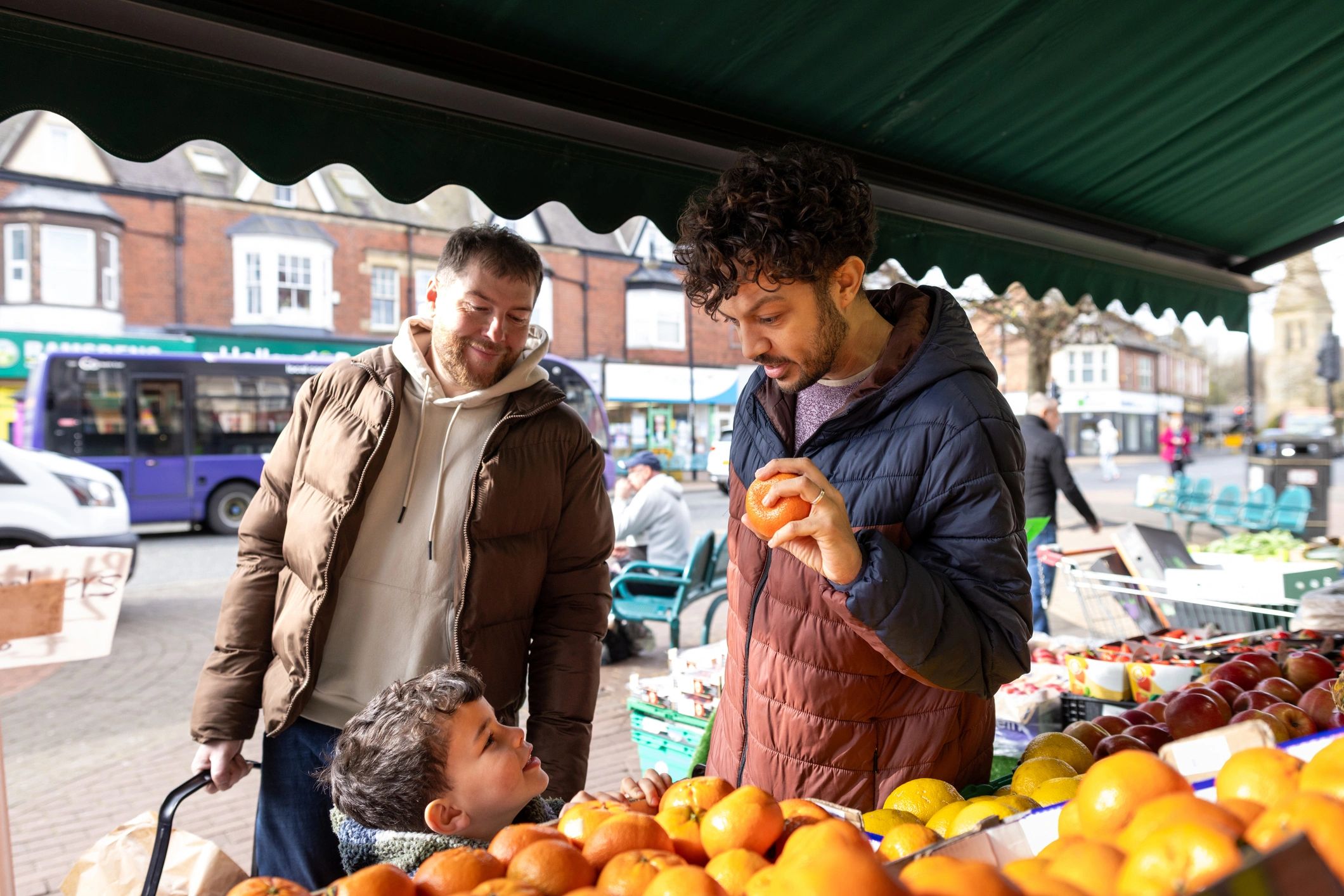 Happy family shopping for fresh ingredients