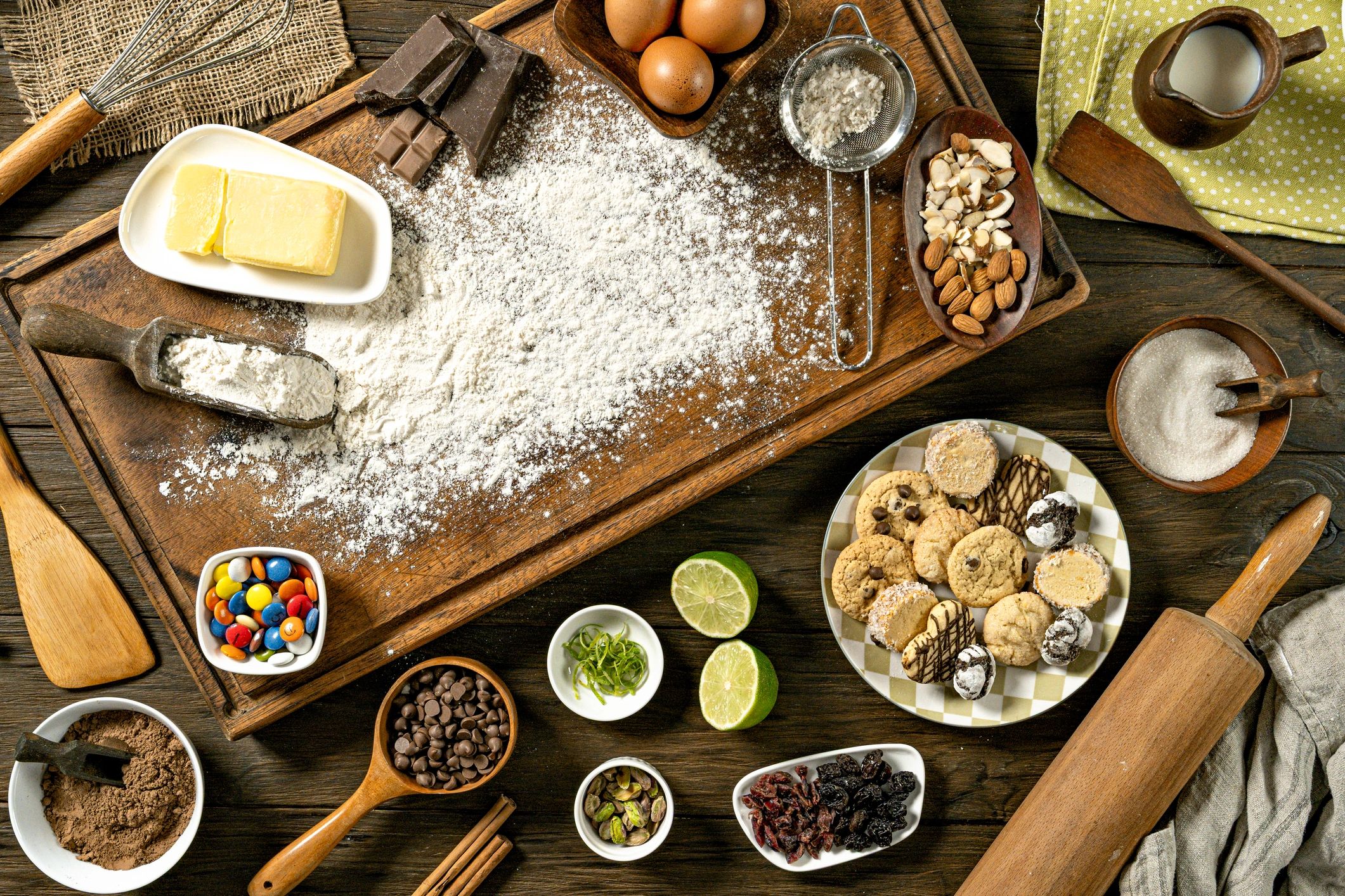 High angle view of arrangement of baking ingredients on a wooden table