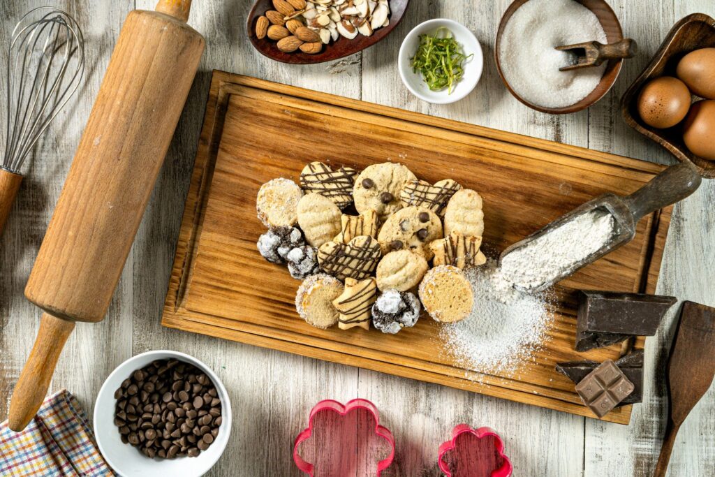 High angle view of arrangement of baking ingredients on a wooden table